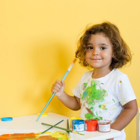 portrait-of-cute-girl-with-paintbrush
