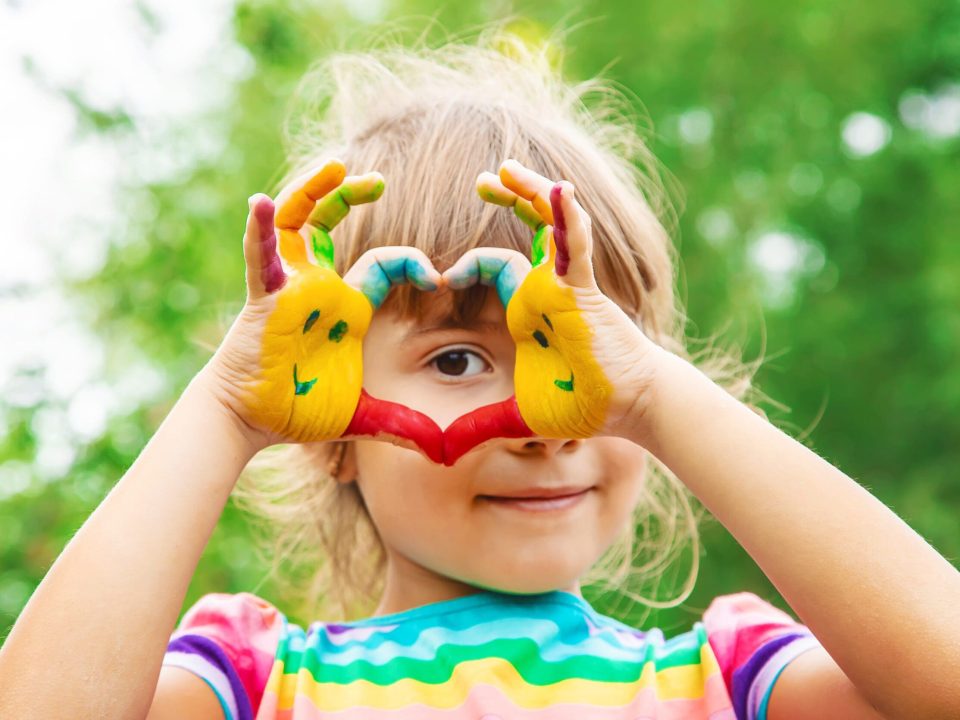 children hands in colors. Summer photo. Selective focus. nature