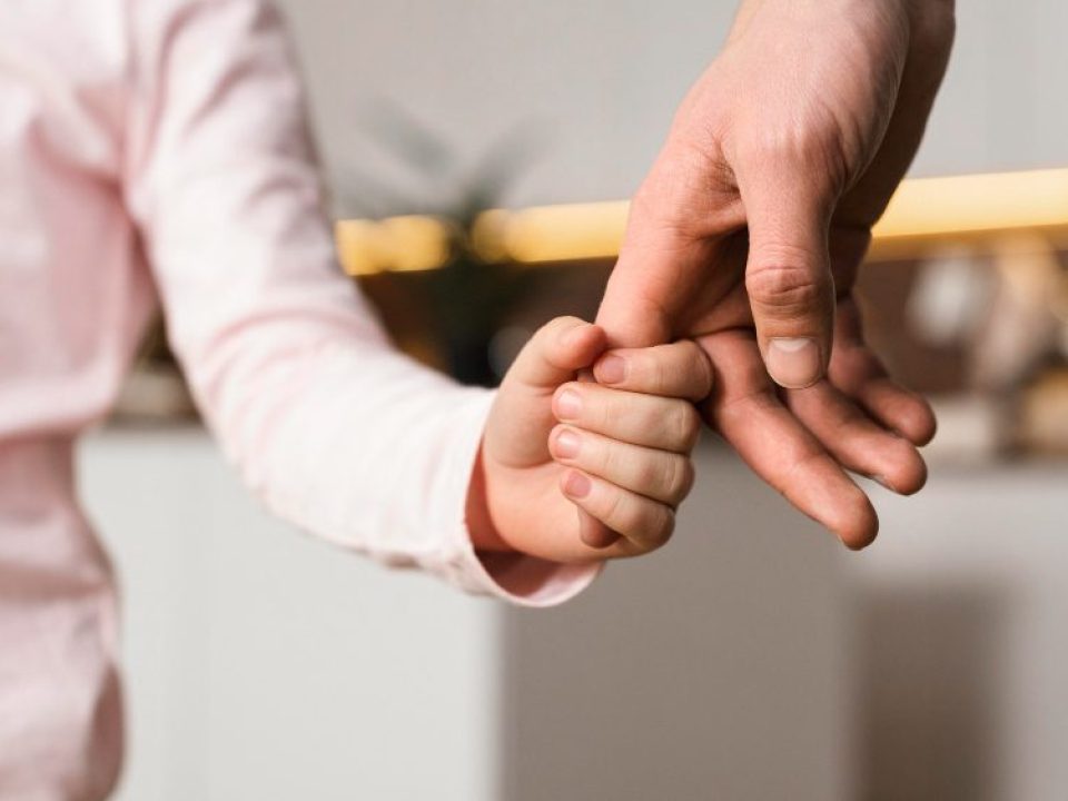 little-girl-holding-hands-with-father