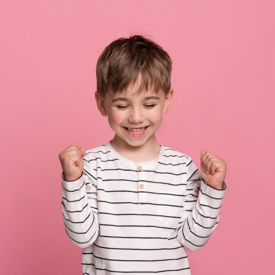 smiley-little-boy-isolated-on-pink