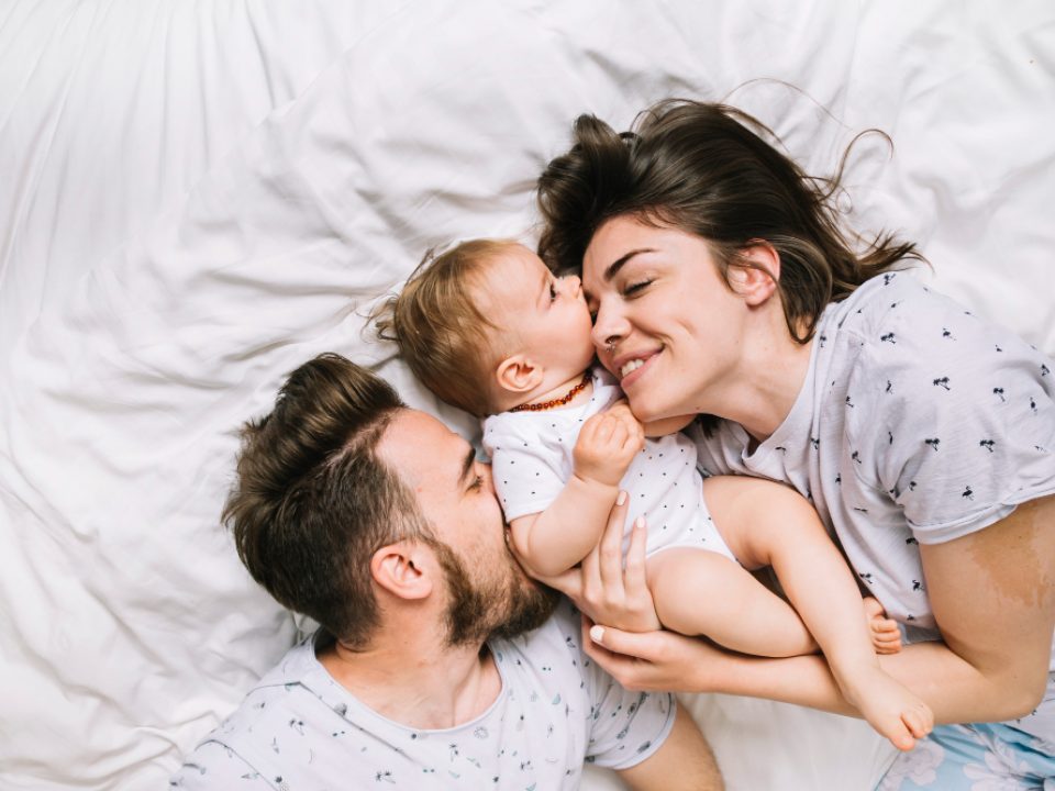 young-couple-with-baby-in-the-morning